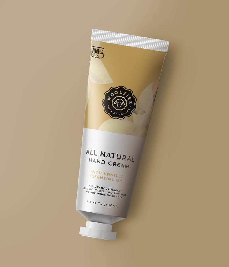 Tube of "Woolzies Nourishing Vanilla Hand Cream" by Woolzies on a beige background, emphasizing its natural ingredients and lack of artificial fragrances.