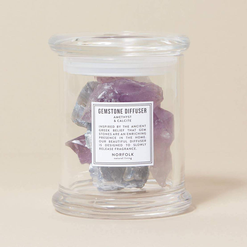 A Norfolk Natural Living Lavender Gemstone Diffuser filled with purple amethyst crystals. The diffuser has a label that reads "English Lavender Amethyst, Norfolk" highlighting its natural, fragrance-releasing properties.