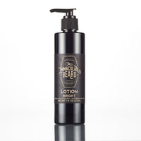 A dark-colored lotion bottle with a pump dispenser labeled "The Immaculate Beard - Body Lotion Bright" against a clean, white background, featuring natural ingredients.