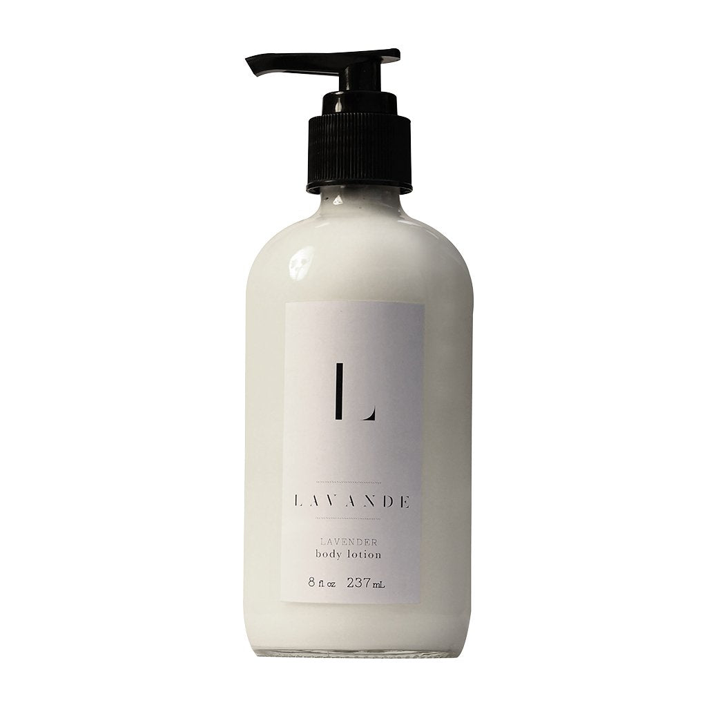 A transparent bottle of Lavande - Lavender Body Lotion with Shea butter and a black pump dispenser, labeled "lavande" in simple, elegant typography on a white label.