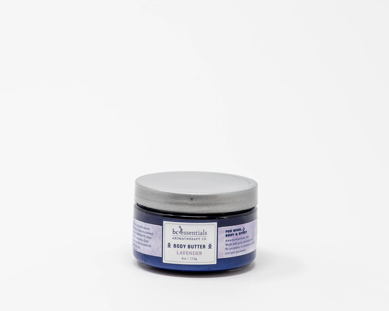 A jar of BC Essentials Lavender Body Butter 4oz, placed against a plain white background. The container has a silver lid and is labeled in blue and white.