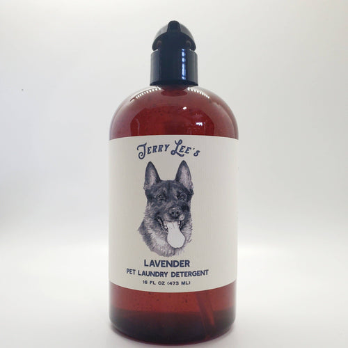 A bottle of Fox + Hound - Natural Pet Laundry Detergent Jerry Lee's Lavender, featuring a label with the illustration of a German Shepherd's face, against a plain white background.