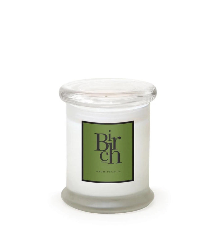 A single Archipelago AB Home Birch Frosted Jar Candle made from a premium soy wax blend in a clear glass Birch Frosted Jar Candle with a birch-scented label from Archipelago Botanicals, placed against a solid white background.