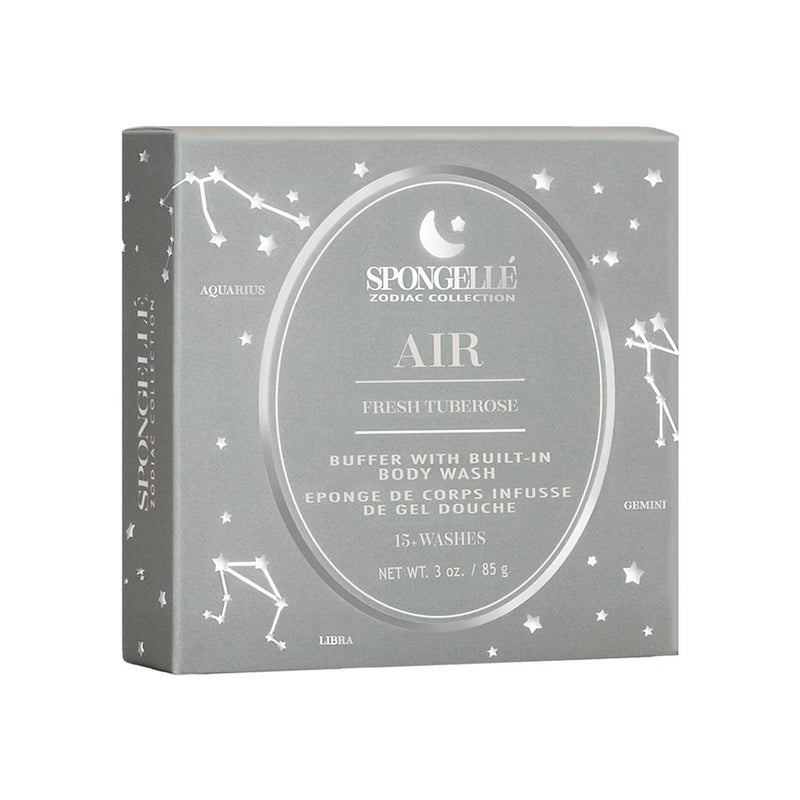 A square gray box labeled "Spongellé Zodiac Collection - Air, Fresh Tuberose" with white astrology star signs and zodiac symbols for Aquarius, Gemini, and Libra. The product is a sponge with