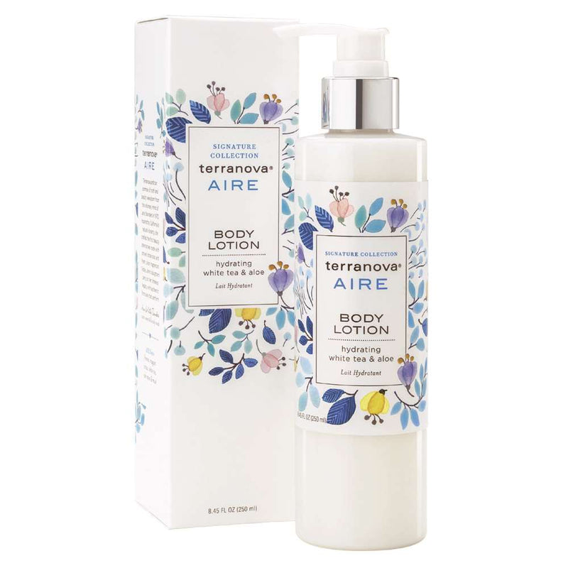 A bottle of Terra Nova Aire Body Lotion Hydrating White Tea & Aloe - 8.45 Fl Oz next to its packaging box adorned with floral designs.