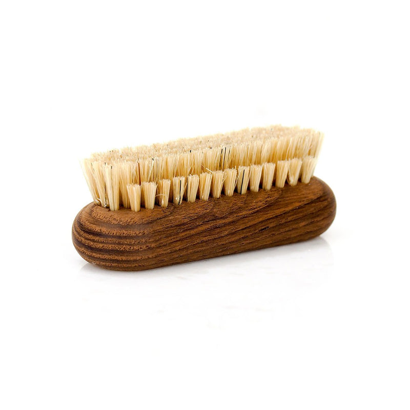 A wooden scrub brush crafted from thermo-treated ash wood, with stiff, natural bristles, isolated on a white background. (Andrée Jardin Heritage Ash Nail Brush)