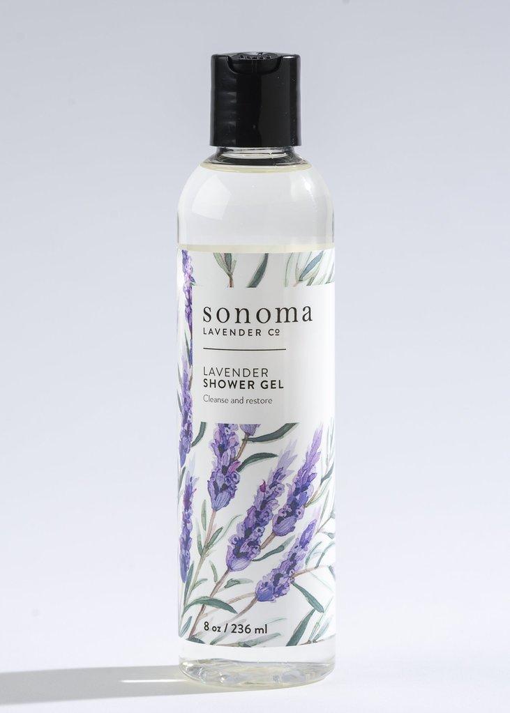Transparent bottle of Sonoma Lavender Shower Gel by Sonoma Lavender Co. with lavender illustrations on the label, against a plain white background. Text on the bottle reads "Lavender Shower Gel with Coconut Oil Cleansing.