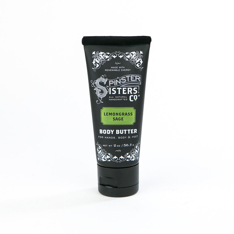 A tube of Spinster Sisters Co. Lemongrass Sage vegan body butter for hands, body, and feet on a plain white background. The tube is black with white and grey decorative text.