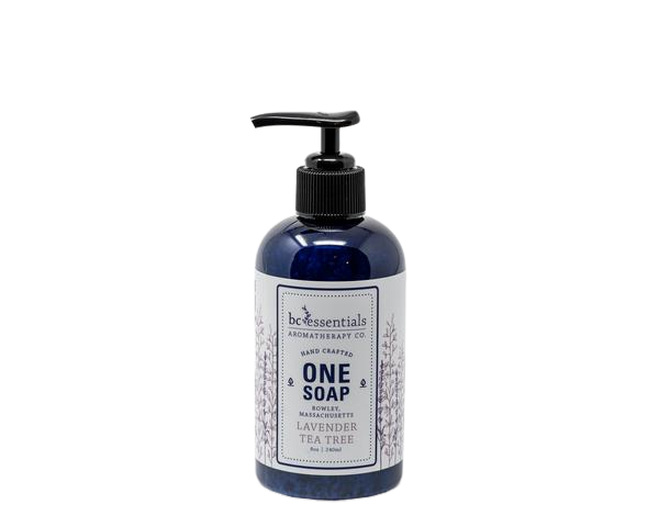 A dark blue bottle of BC Essentials - Lavender Tea Tree One Soap with a pump dispenser, labeled as "one soap" with lavender and tea tree essential oils, isolated on a white background.