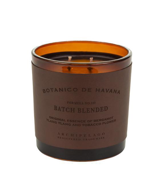 A Archipelago Botanico de Havana Letter Press Candle in a brown glass container with three wicks, labeled "botanico de havana, batch blended" with notes of bergamot, ylang-ylang, and