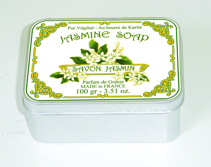 A decorative tin of Le Blanc Jasmine 100gm Soap with intricate floral and scroll designs on the label, highlighting the words "jasmine soap" and "made in Provence" and an illustration of jasmine flowers from Le Blanc Made in France.