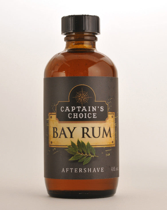 A bottle of Captains Choice Bay Rum Aftershave with essential oils and a vintage-style label, placed against a light gray background.