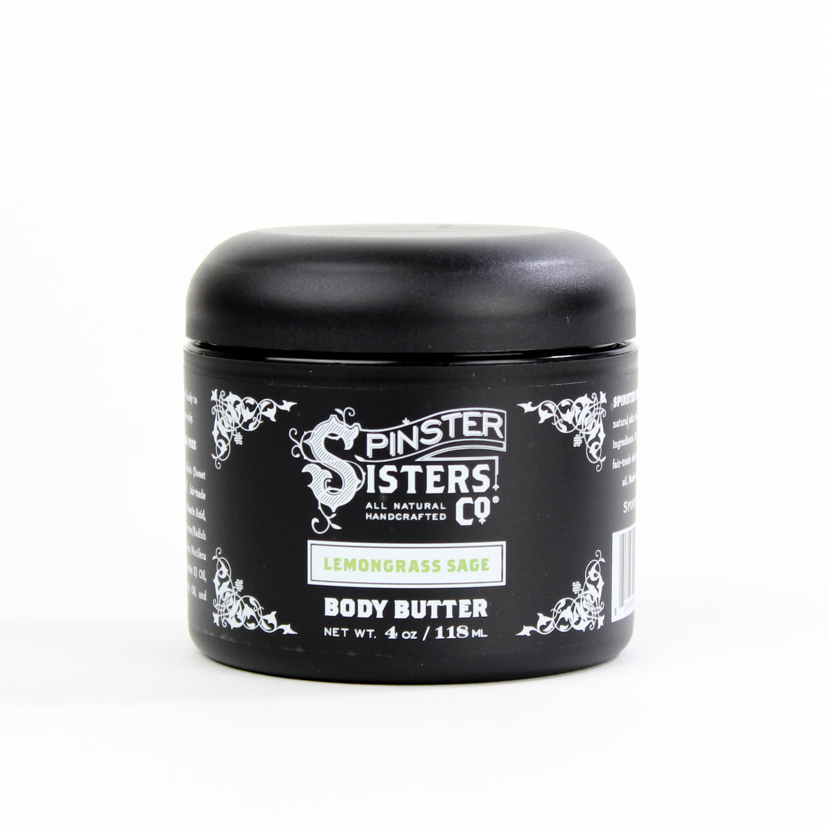A black jar of Spinster Sisters Body Butter 4oz Jar - Lemongrass Sage with shea butter against a white background. The label features white and silver decorative accents and text.