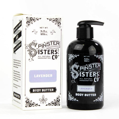 A black bottle and a white box of Spinster Sisters Lavender Body Butter - 8oz, featuring ornate black and white labels, with lavender essential oil indicated. Both items are displayed against a plain white background.