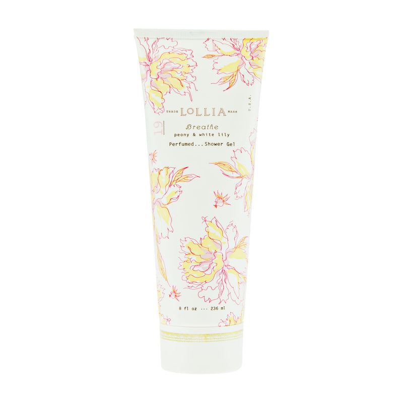 A tall cylindrical tube of Margot Elena's Lollia Breathe Perfumed Shower Gel, decorated with soft pink and yellow floral designs. The packaging displays peony, white lily fragrances, and leafy notes.