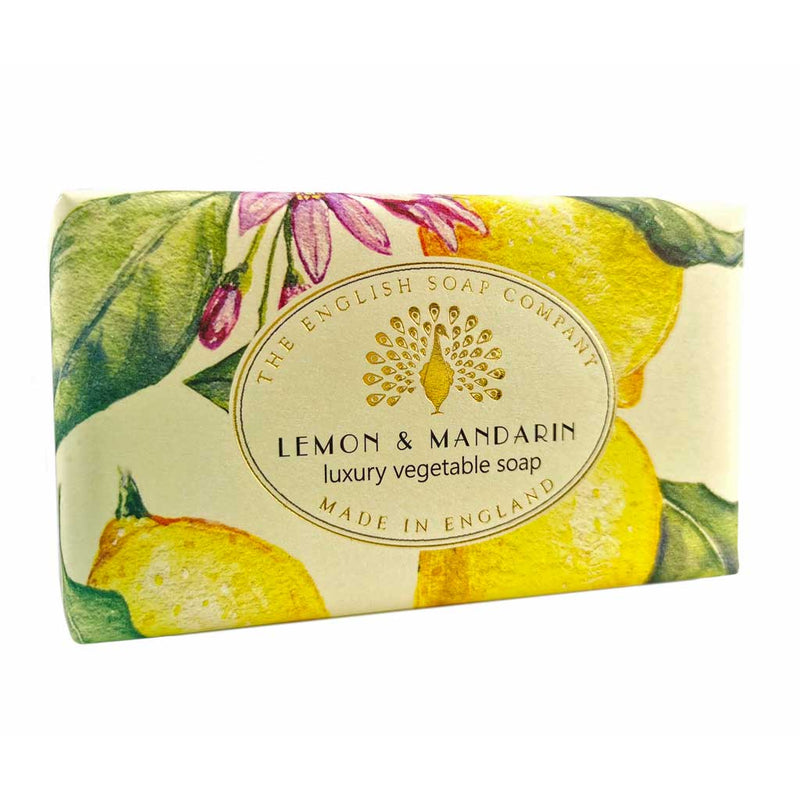 A bar of "The English Soap Co." Vintage Lemon Mandarin Italian Wrapped Soap, featuring vibrant illustrations of citrus fruits and leaves on the packaging.