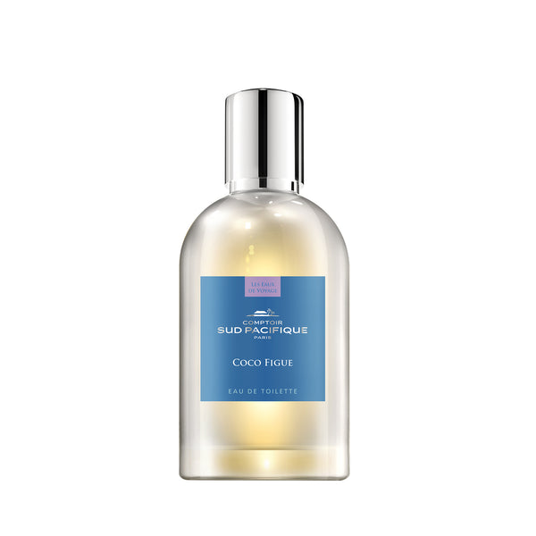 A transparent perfume bottle with a silver cap, labeled "Comptoir Sud Pacifique Paris Coco Figue EDT - 3.3 fl oz" in blue and white text on a yellow to clear gradient background adorned with tropical coconut.