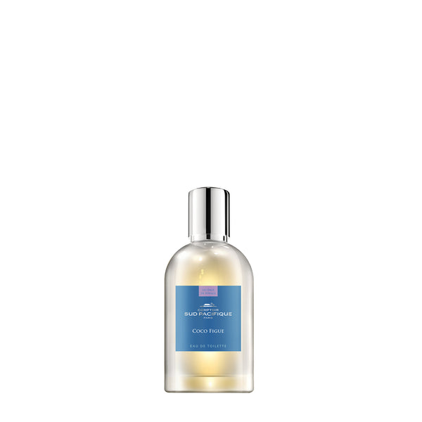 A transparent bottle of Comptoir Sud Pacifique Paris Coco Figue eau de toilette displaying a minimalist design with a silver cap and clear, labeled contents visible through the bottle. The scent prominently features Comptoir Sud Pacifique Paris Coco Figue EDT - 1 fl oz.