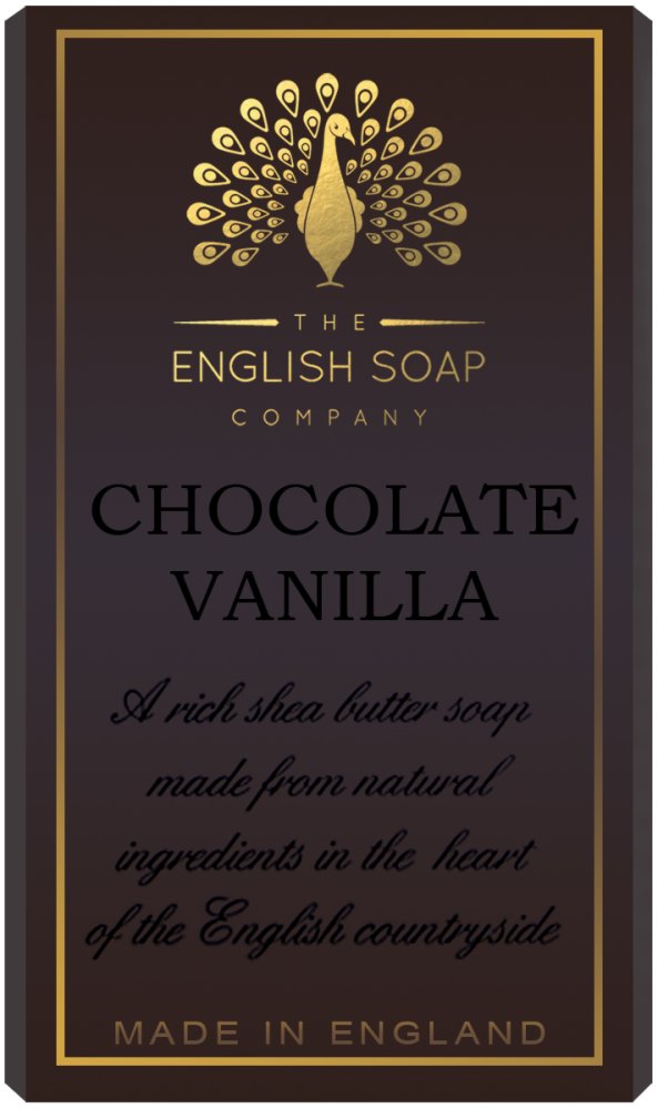 A tall, elegant soap box labeled "The English Soap Co. Pure Indulgence Chocolate Vanilla Soap" with a gold peacock design, text describing it as a vegan friendly shea butter soap with natural ingredients from the English.