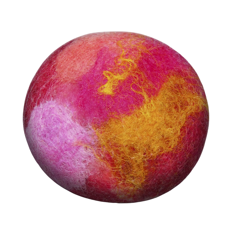A close-up image of a Fiat Luxe - Citrus Spice Felted Soap ball with a vibrant mix of pink, purple, and yellow hues, isolated on a white background.