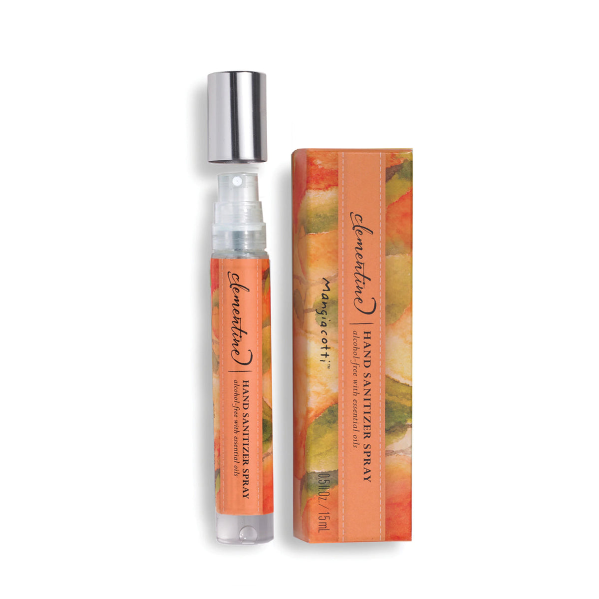 A spray bottle of Mangiacotti Clementine Hand Sanitizer Spray next to its packaging box with floral prints. The clear bottle displays orange-text Mangiacotti branding and is partially filled with pink liquid.