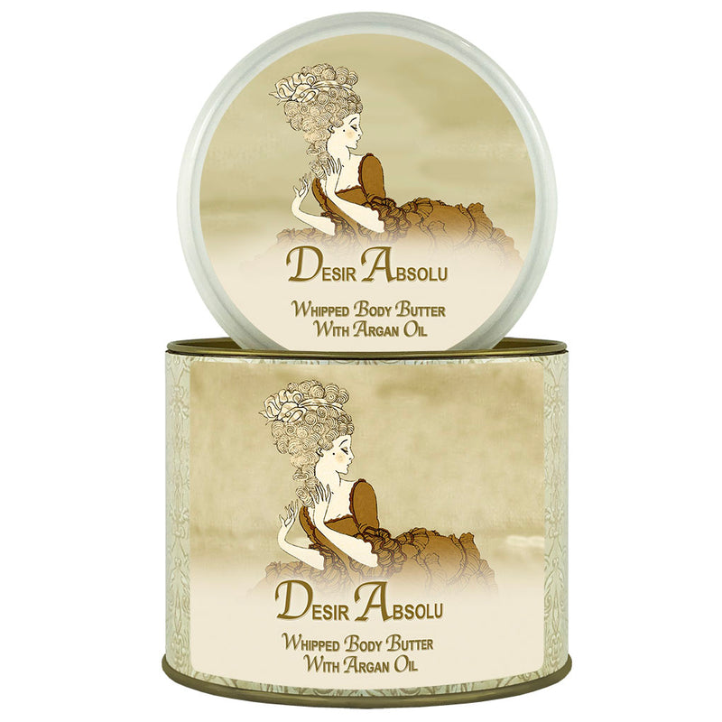 Illustration of a vintage-style tin featuring La Bouquetiere Desir Absolu Argan Oil Whipped Body Butter with argan oil and shea butter. A classic sepia-tone label depicts a woman in an elegant, flowing dress, applying the cream.