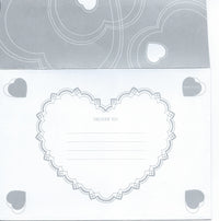 An image of a Greeting Cards Valentine's Day Greeting Card featuring a large heart shape with lace detailing in the center labeled "deliver to:", surrounded by smaller heart motifs and a "first class" stamp in the top right corner
