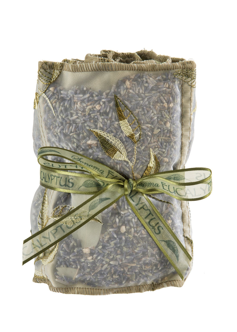 Clear decorative bag filled with dried lavender, tied with a green ribbon labeled "Sonoma Eucalyptus Sachets-by-the-Yard - 36" scent" against a white background.