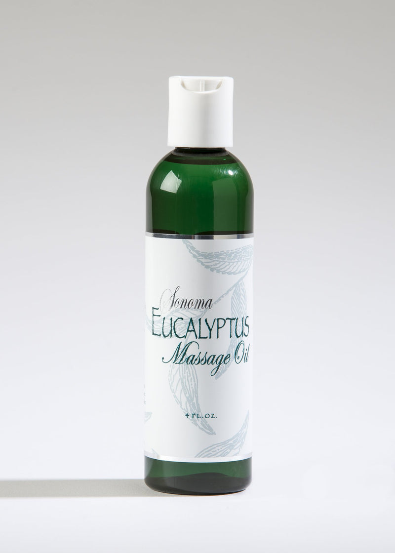 A cylindrical bottle of Sonoma Eucalyptus Massage Oil by Sonoma Lavender displayed against a light background. The bottle is green with a white label featuring eucalyptus leaf illustrations.