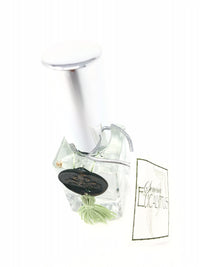 A decorative Sonoma Eucalyptus Essential Oil Spray-themed car air freshener from Sonoma Lavender with a clear cube reservoir, green ribbon, and botanical elements encased inside, isolated on a white background.