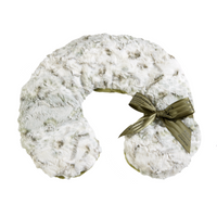 A fluffy white Sonoma Lavender neck pillow with a silky green ribbon tied in a bow, isolated on a white background. The Sonoma Eucalyptus Snowy Sage Neck Pillow is designed to provide muscle therapy and support for the neck and shoulders.