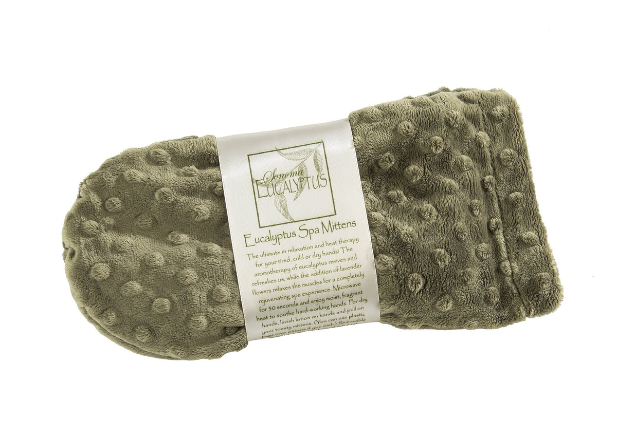 A rolled-up Sonoma Eucalyptus Green Dot Spa mittens with a label reading "Sonoma Eucalyptus Green Dot Spa Mittens" attached to it, isolated on a white background. The fabric has