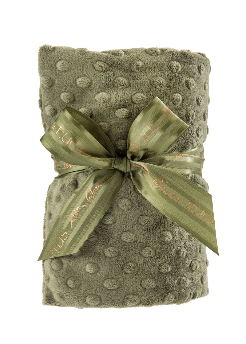 A rolled Sonoma Eucalyptus Spa Green Dot Heat Wrap with a textured pattern, tied with a silky ribbon featuring the word "felice" in a decorative script, ideal for deep heat therapy by Sonoma Lavender.