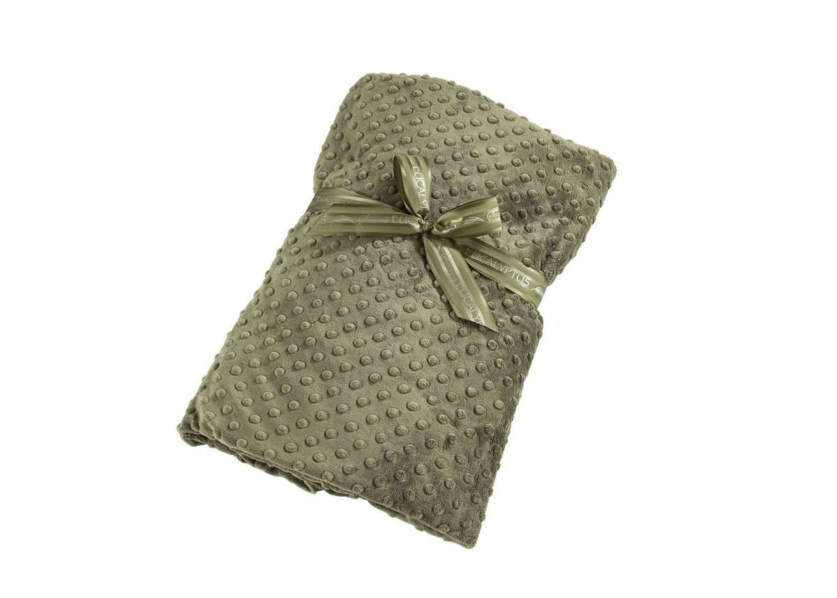 A soft, Sonoma Eucalyptus Spa Green Dot spa blankie with a textured bubble pattern, neatly folded and tied with a matching satin ribbon, isolated on a white background.
