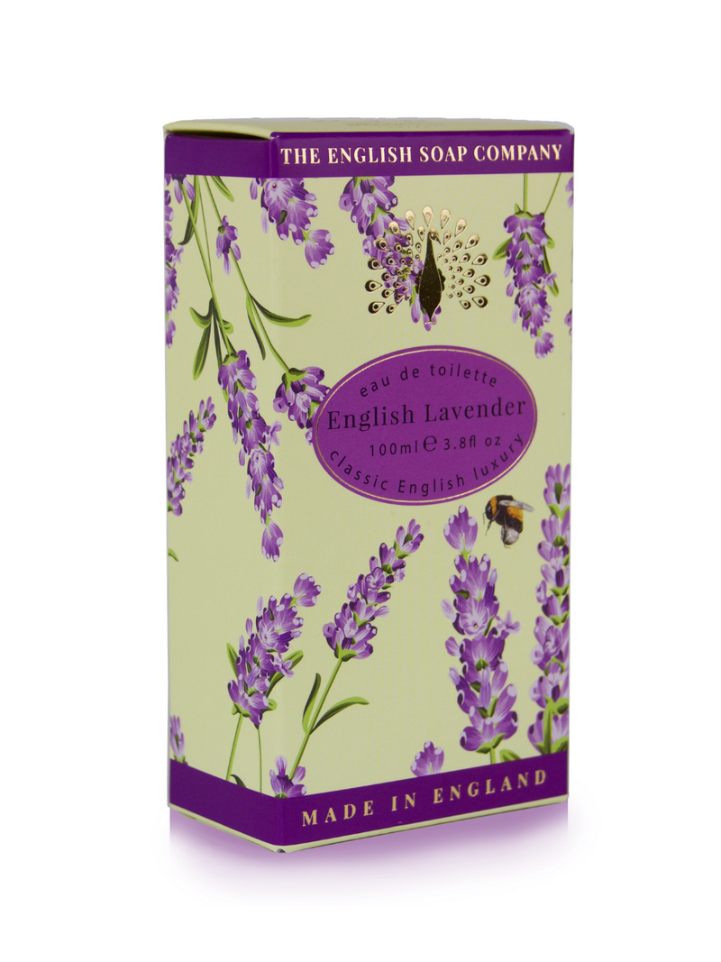 A purple and green box of The English Soap Co. English Lavender Eau de Toilette, featuring illustrations of lavender sprigs and a butterfly, enriched with vitamin E, isolated on a white background.