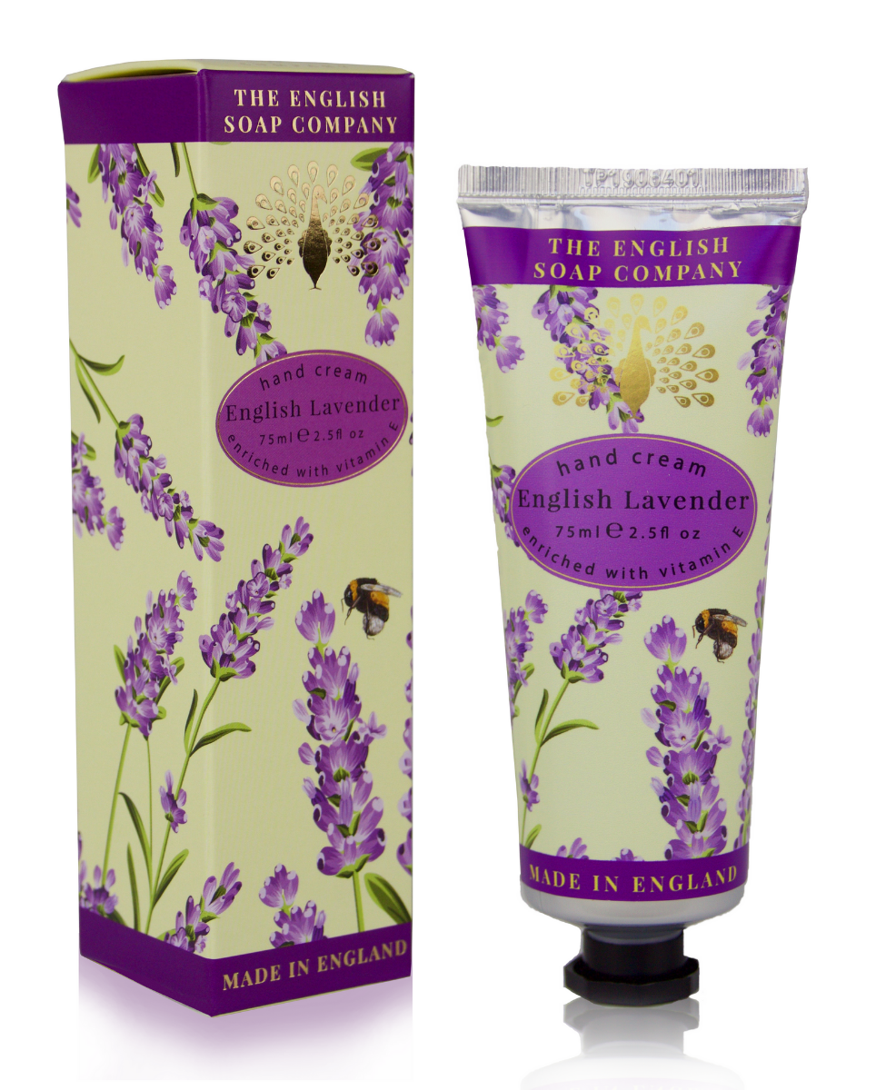 Packaging of The English Soap Co. English Lavender Hand Cream and its box, both featuring a lavender rosemary mint floral design with bees, highlighted by a purple and gold color scheme. Text describes the product as English.