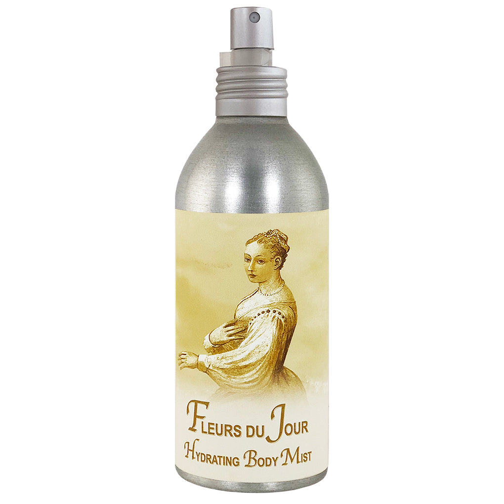 A metallic spray bottle of La Bouquetiere Fleurs du Jour Body Mist featuring a vintage-style illustration of a woman in historical dress on the label.