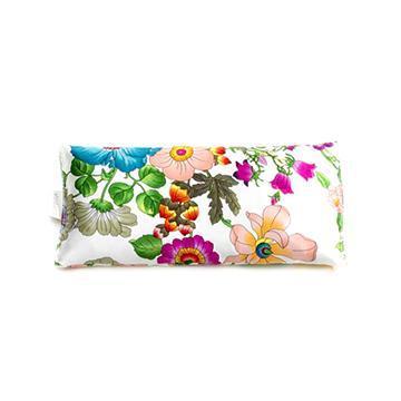 A rectangular cosmetic bag with a vibrant floral print featuring large, colorful flowers and an Elizabeth W Silk Eye Pillow - Floral Blush on a white background.