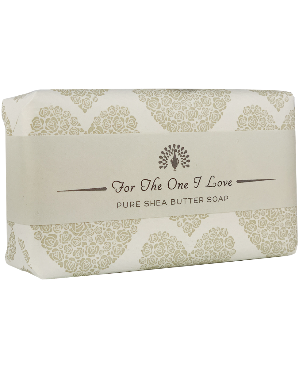 A bar of The English Soap Co. For The One I Love Grey Heart Special Occasion Soap in a cream-colored wrapper, adorned with ornate green patterns and the words "for the one i love" printed on it.