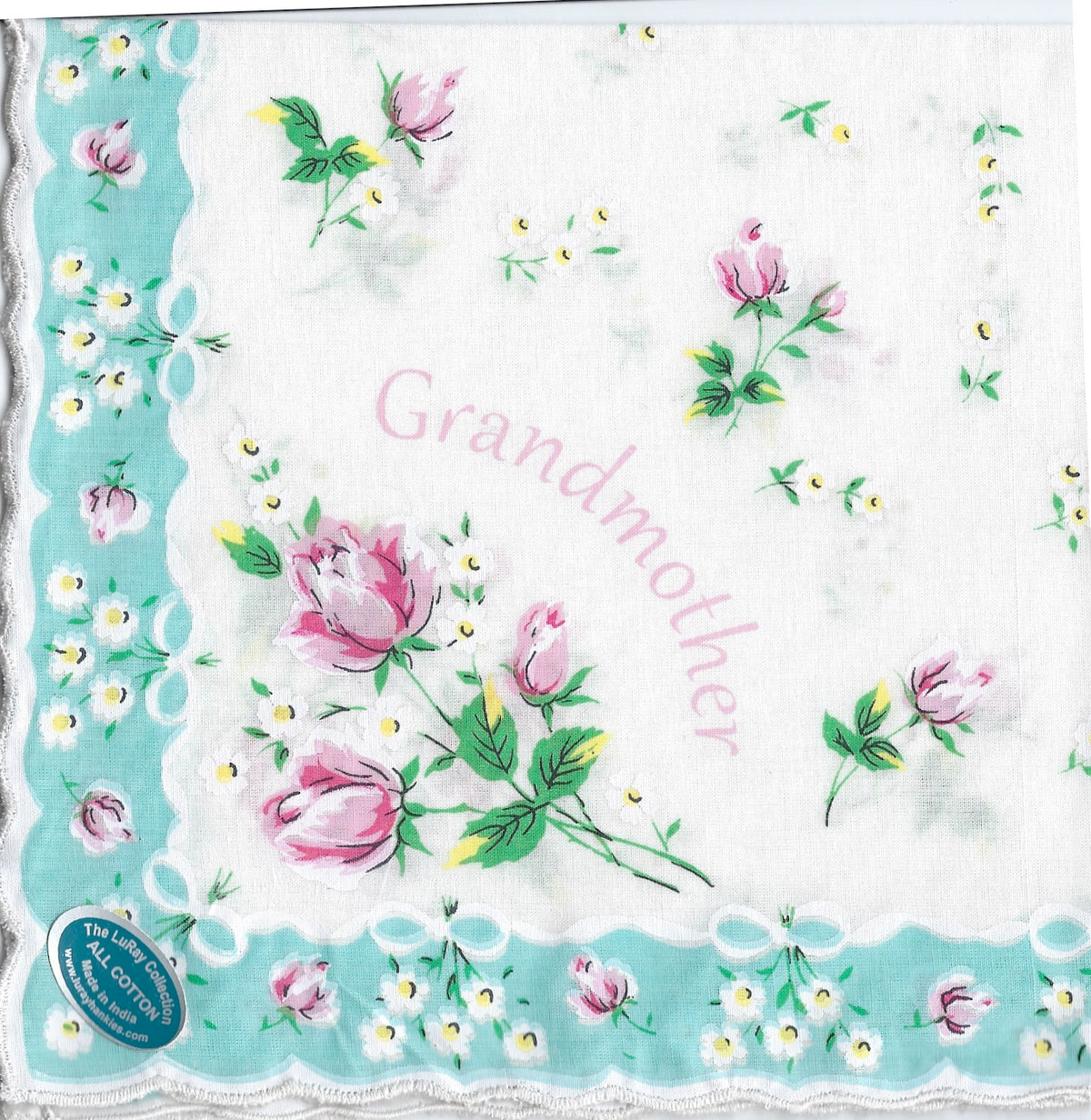 A square Grandmother Hanky crafted from 100% pure cotton, featuring scalloped edges and decorated with pink flowers and the word "grandmother" in the center. A tag indicates "the Leonardo from Hankies ala Carte".