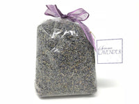 A clear plastic bag filled with culinary grade lavender flower buds, tied at the top with a purple ribbon, and a label reading "Sonoma Lavender Botanicals" on a white background.