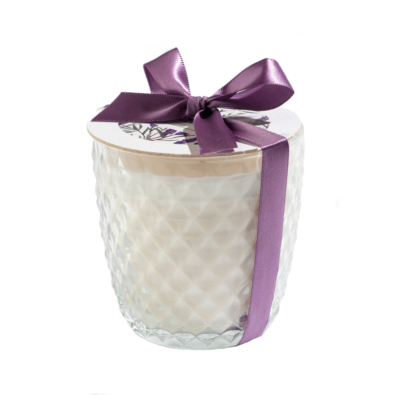 A textured diamond cut glass candle jar with a wooden lid, wrapped with a purple ribbon tied in a bow, isolated on a white background featuring the Sonoma Lavender - Ivory Round Diamond Glass Candle by Sonoma Lavender.