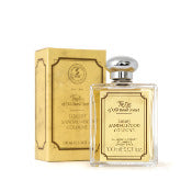 A bottle of Taylor of Old Bond Street Sandalwood Luxury Sandalwood Cologne next to its elegant golden packaging, displayed against a white background with hints of masculine scent.