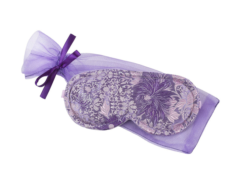 A Sonoma Lavender Sleep Mask in Chrysanthemum Silk with delicate floral patterns and a matching ribbon tie, isolated on a white background.