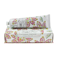 Two tubes of Margot Elena's Library of Flowers Honeycomb Hand Creme, enriched with shea butter, in ornate floral packaging with text in English and Cyrillic, isolated on a white background.