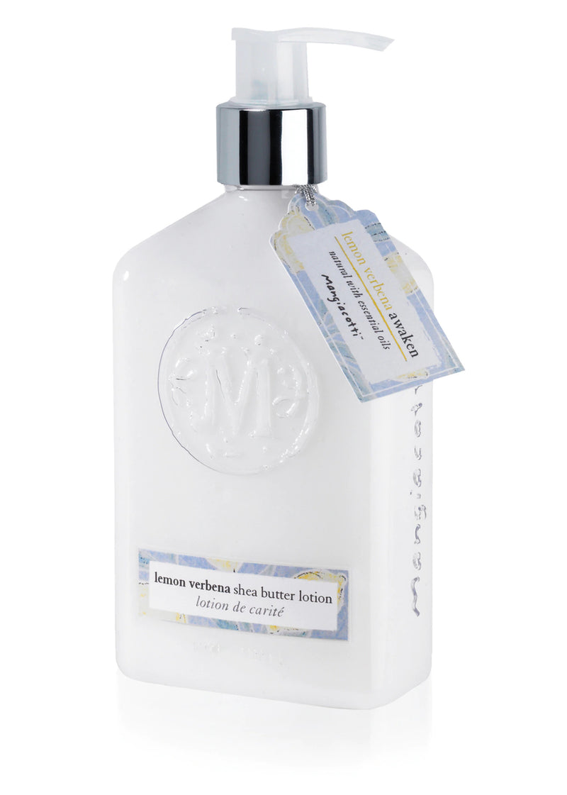 A white dispenser bottle of Mangiacotti Lemon Verbena Shea Butter Lotion with essential oils, featuring a label and a hanging tag on a white background.