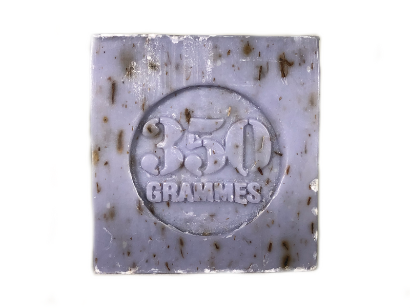 A square block of La Lavande Cube Lavender Flower Soap 350gm with embedded text "360 grammes" visible in raised letters, set against a white background. The soap shows signs of usage with some spots and streaks.