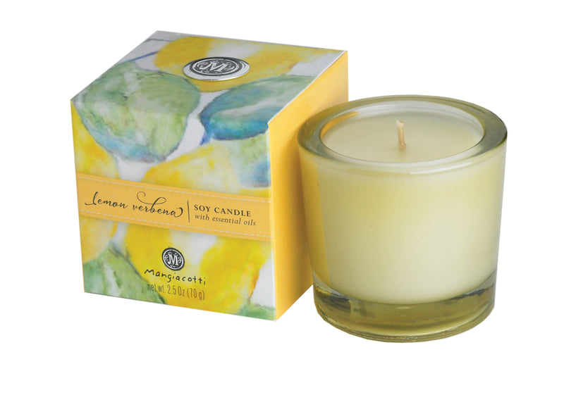 A Mangiacotti Lemon Verbena Soy Candle in a clear glass holder, next to its vibrant yellow and green watercolor-patterned packaging box labeled with the product details.