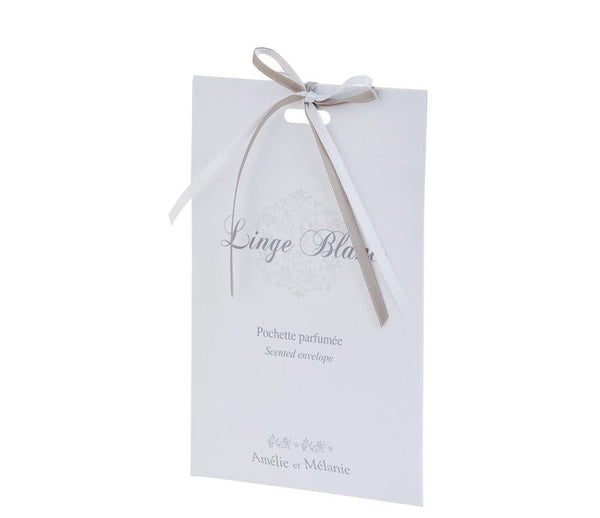 An elegant white scented envelope with a gray ribbon tied in a bow at the top, labeled "linge blanc" and "amélie & mélanie" in sophisticated script font, infused with Lothantique's Amelie et Melanie Ligne Blanc Scented Sachet Envelope.