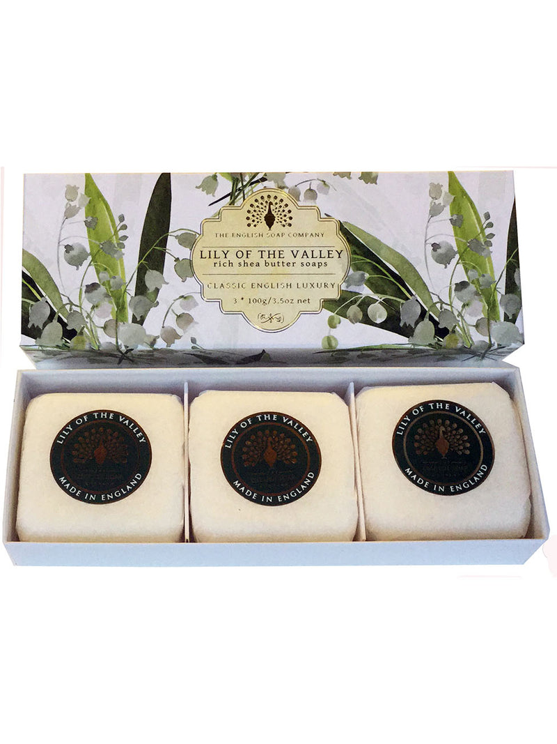 A box of three "lily of the valley" scented hand soaps, presented in a white box with a floral design and marked with "made in England." Each soap is individually packaged in The English Soap Co. Lily of The Valley Gift Box Hand Soap.